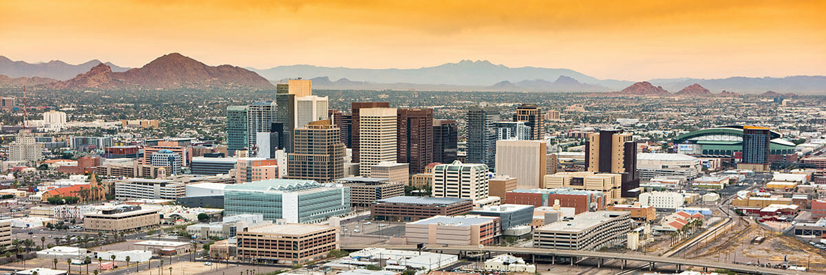 Panoramic aerial view of the Phoenix Arizona skyline against the days blue sky